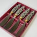 Vintage Salmon Spreaders, butter knives, sleeping cats/kitten