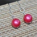 Sterling silver dangling earrings in hot pink- shell pearls, sterling silver French hook ear wires