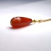 Faceted Carnelian Oval teardrop Red semi precious Stone Pendant on a delicate gold plated chain