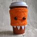 Arbuckle - a monster coffee cozy and arm cuff in pumpkin spice orange