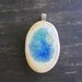 Oval ceramic pendant with glass