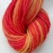 Hand painted yarn gold scarlet red 50g