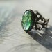 Adjustable antiqued brass ring with vintage blue green opal glass cabochon - Dragon scale