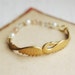 Golden brass swan bracelet with vintage beads in pink and white - Swanlights.