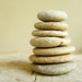 STONE WHEELIES..7 center-drilled beach stones, pebbles, organic bead, tribal
