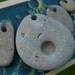 STONE CRATER...for the love of our space, beach stones, natural history, good luck fortune, natural holes pebbles grey