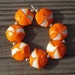 Lampwork beads orange and white lentils, "Juicy"