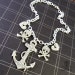 PIRATES BOOTY - Anchor Skull and Crossbones Charm Necklace - Silver Glitter Laser Cut Acrylic