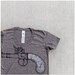 Sure Shot - tshirt for women - MEDIUM - antique pistol screenprint on American Apparel heather brown track tees
