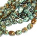 8 in strand of African Turquoise Smooth Nugget 13X18mm