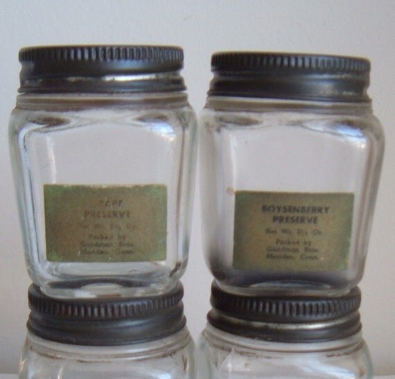 four small vintage jam jars