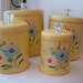On Hold for louise....FABULOUS FIFTIES RANSBURG TOLEWARE HANDPAINTED YELLOW FLOWER CANISTERS WITH GLASS KNOBS