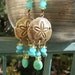 Long sand dollar earrings, antiqued brass sanddollar, seafoam blue green glass beads, ocean themed sea shore beach hippie rustic luck aged