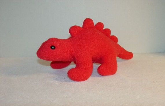 red stuffed dinosaur