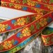 3 yards FLORALY Jacquard trim. Yellow, emerald green, turquoise, on red. Yellow edges. 1 inch wide. 660-A