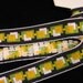 2 3\/4 yards of vintage FIFTIES CUBIC Jacquard trim in yellow, white, green on black. 1 inch wide. 588-B