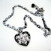 Heart Skull Necklace - Swarovski Crystal silver skull and crossbones charm over a black heart with black and white chain - Goth Rocker