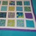King size turquoise, green and purple quilt