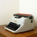 Gray and Red Metal Manual Typewriter