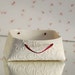 porcelain container (small). white ceramic tea / sugar bag vessel. Porcelain bag collection designed and crafted by Wapa Studio.