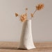 Decorative porcelain mini vase. Artful ceramic mini vessel. Artful Dodger Variations (Object N.1) by Wapa Studio.