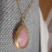 Pink quartz tear drop in gold bezel necklace