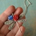 La Libellule Necklace in antiqued silver with red resin rose and blue jade stone