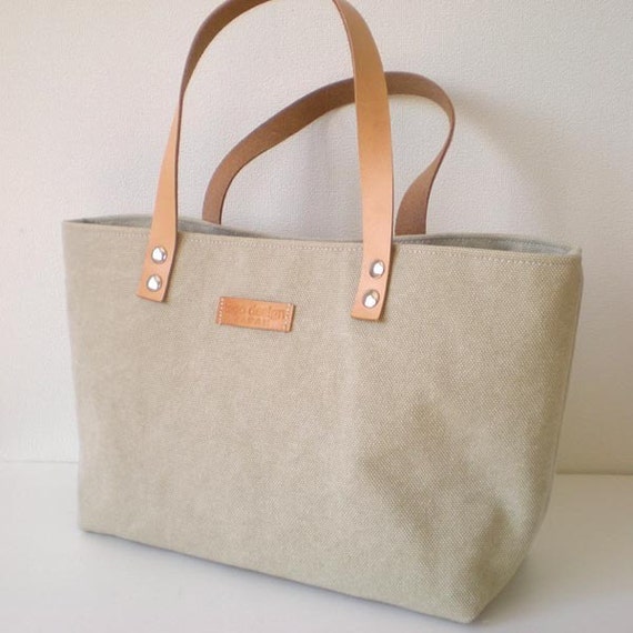 Mini canvas tote bag with leather straps in beige by tagodesign