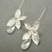 long silver butterfly crystal earrings by rockedjewelry