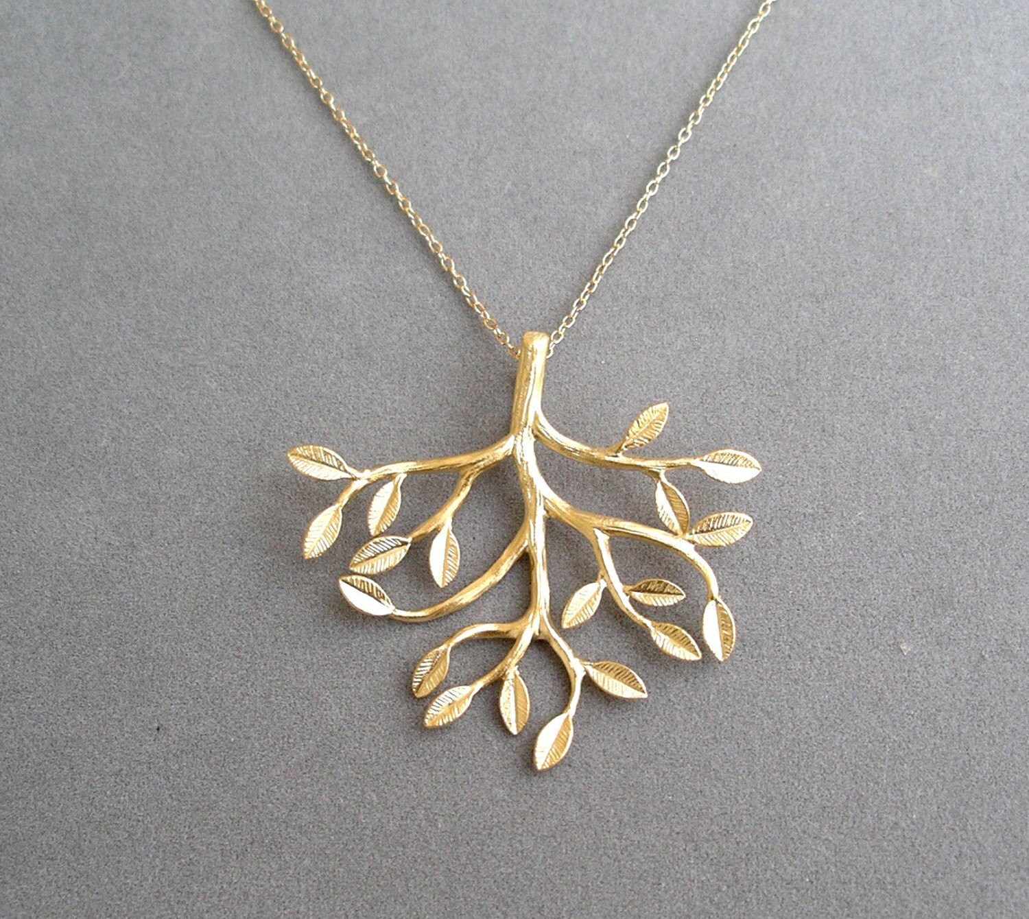 gold tree pendant necklace on gold chain