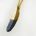 Hand Dipped Brass Feather Necklace In Pigeon Grey