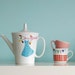 Large polkadot dress on a branch teapot