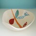 A bird on the leaves bowl