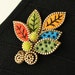 Felt and zipper multi leaf brooch