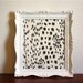 Bulletin board with designer fabric in white painted frame