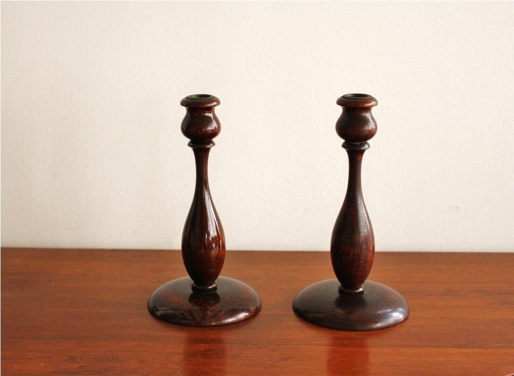 Pair of tall antique wooden candlesticks