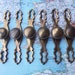6 vintage round distressed metal knobs with curvy metal trimplates includes hardware