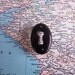 Small black painted metal vintage faux keyhole handle for decor or projects