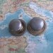 2 vintage distressed brass metal knobs with matching round trimplates includes hardware