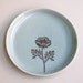 7.5-inch breakfast, salad, or dessert plate with ranunculus, in ocean blue