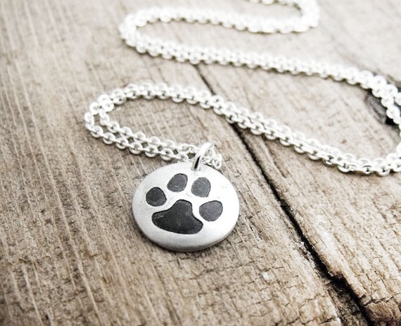 Tiny cat paw print necklace in silver