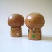 Pair of vintage Kokeshi dolls with big heads.