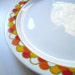 Carousel. Vintage 1970s Georges Briard chop plate.