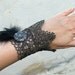 Rococo Silver Glam Black Feather Wrist Cuff with Amazing Crystal Button