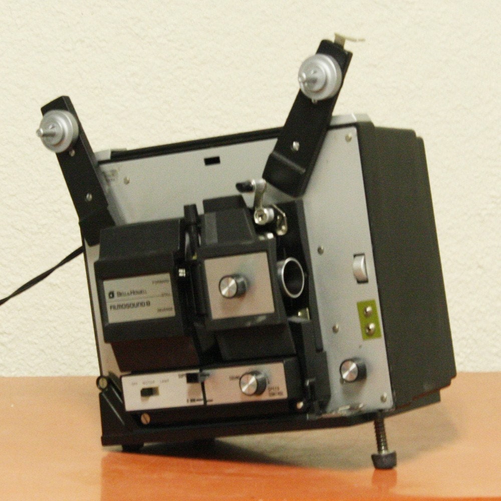 Vintage movie projector bell and howell super 8