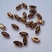 Lot of 7 10x4mm Capri Gold Navette Vintage Swarovski Rhinestones in Sew On settings