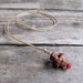 vintage 1930s peach pit monkey charm necklace
