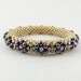 Bead Rope Flower Bangle Yellow with Purple & Aqua Blossoms - Item 1210