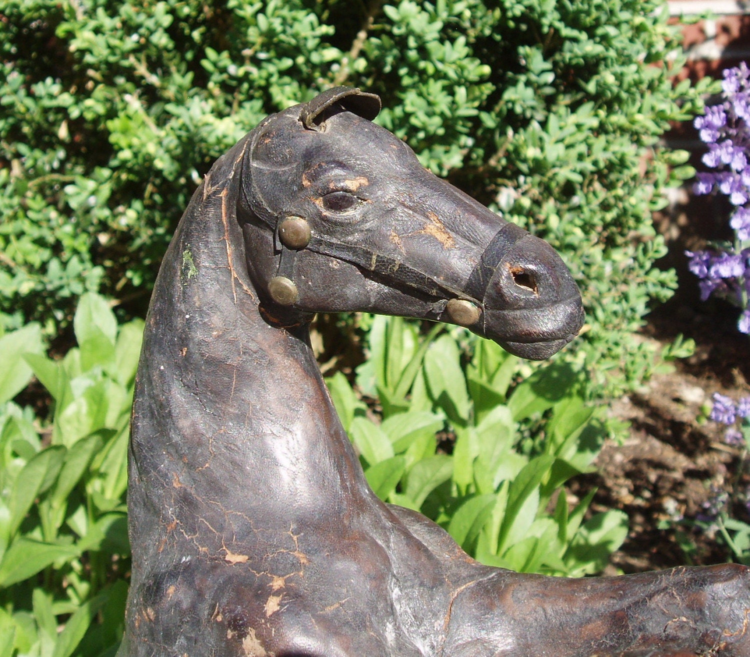 antique leather horse figurine