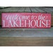 Welcome to the lakehouse red and light teal repurposed sign